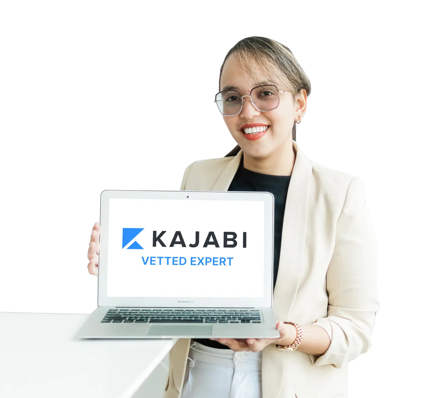 Lou holding a laptop with the Kajabi Expert Badge